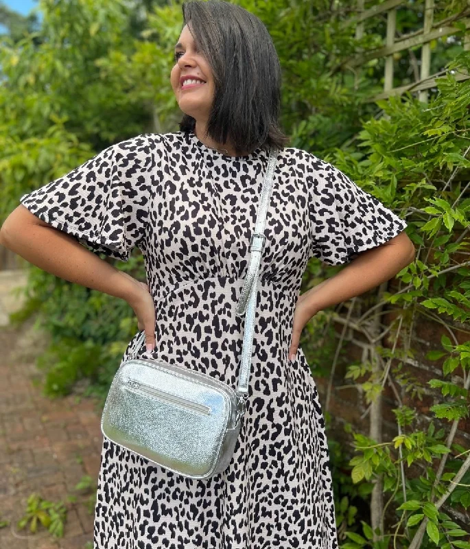 Feathered - Trimmed Casual Dresses for a Dramatic Look Ivory & Black Leopard Print Kate Dress Feathered - Trimmed Casual Dresses for a Dramatic Look Ivory & Black Leopard Print Kate Dress