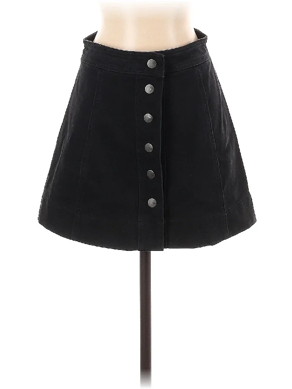 Denim skirts with fishnet tights for a bold and daring look Denim Skirt