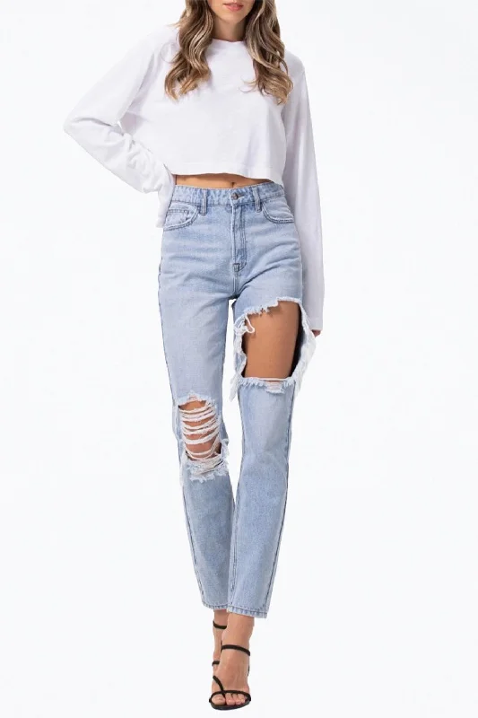 Ripped women jeans for a rebellious and fashion - forward style High-Rise Distressed Tapered Jeans In Light Blue Ripped women jeans for a rebellious and fashion - forward style High-Rise Distressed Tapered Jeans In Light Blue