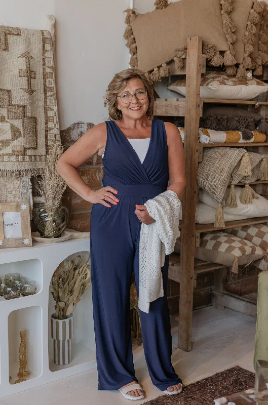 Women jumpsuits with cut - out details on the bodice for a trendy and bold look RHIANNAN SLEEVELESS JUMPSUIT WITH POCKETS 2 COLOR OPTIONS Women jumpsuits with cut - out details on the bodice for a trendy and bold look RHIANNAN SLEEVELESS JUMPSUIT WITH POCKETS 2 COLOR OPTIONS